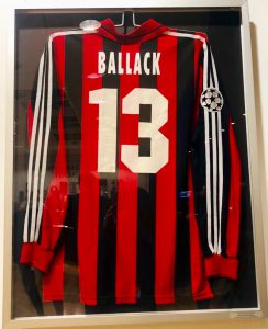 A framed football shirt from Number 13 Michael Ballack