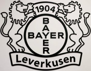 Two lions either side of the Bayer logo