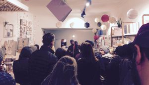 Crowd packed into the Fawntastic shop, watching Wallace Water sing