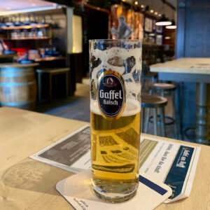 A half-full glass of Gaffel Koelsch beer in Cologne, Germany