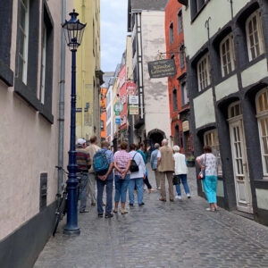 Walking tour group heads into the Altstadt Cologne