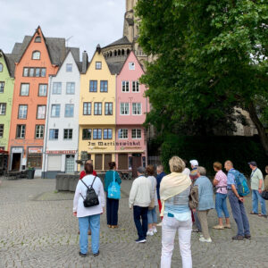 Tour guide leading a walking group through the old town, Cologne